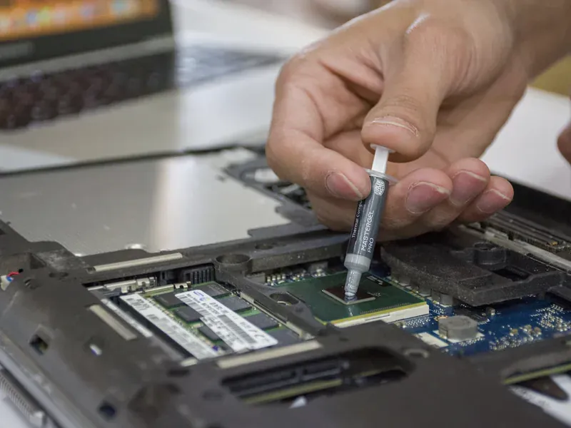 Thermal compound being applied to an electronic processor for heat transfer