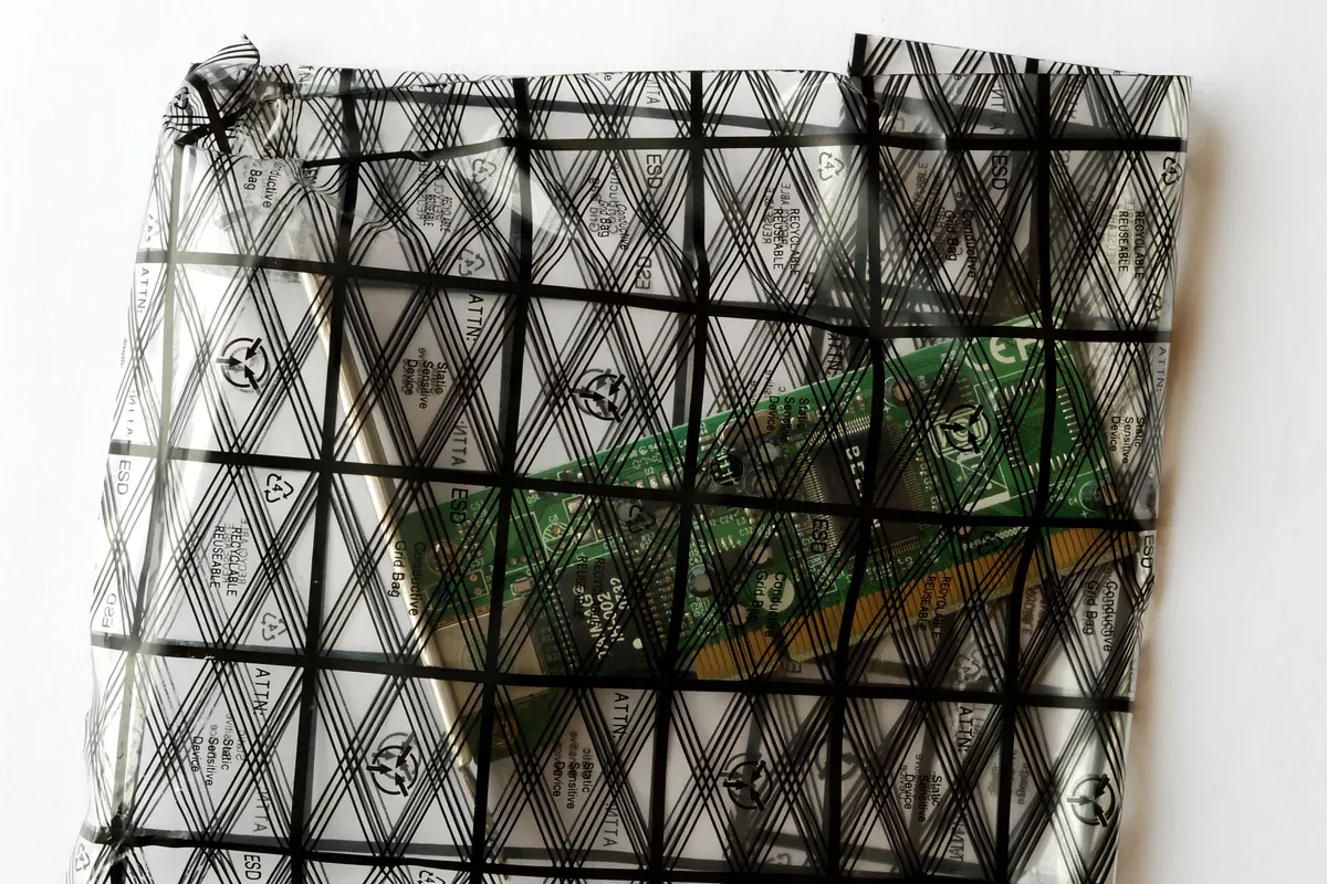 Electronic components contained in ESD-protective packaging