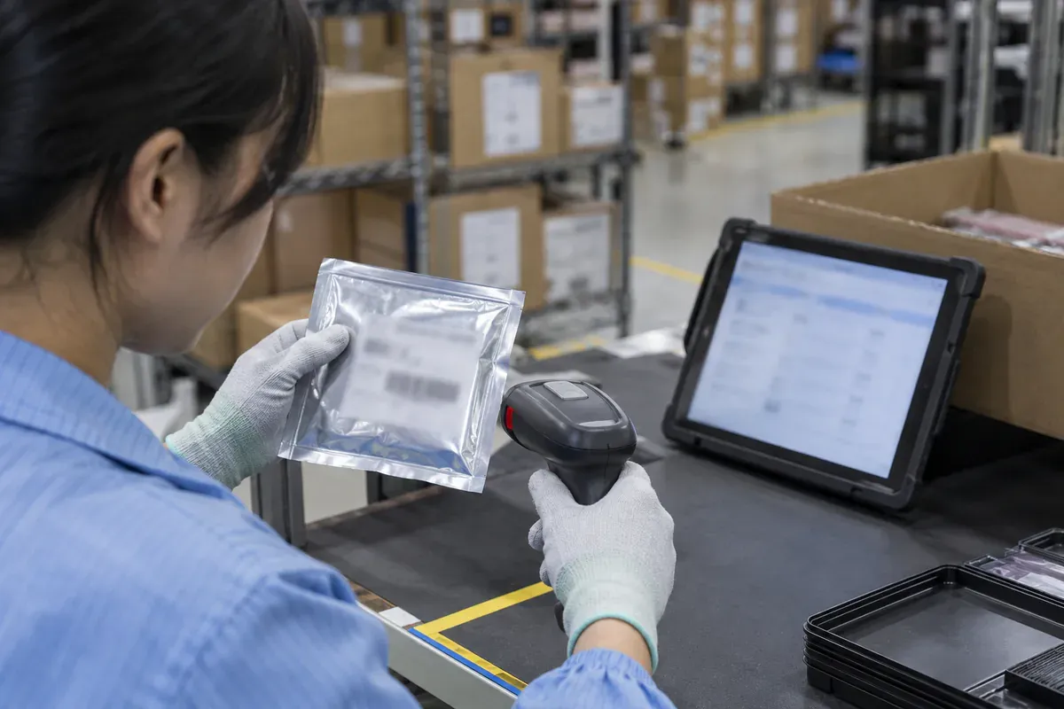 Component labels and lot records being checked at an inspection desk