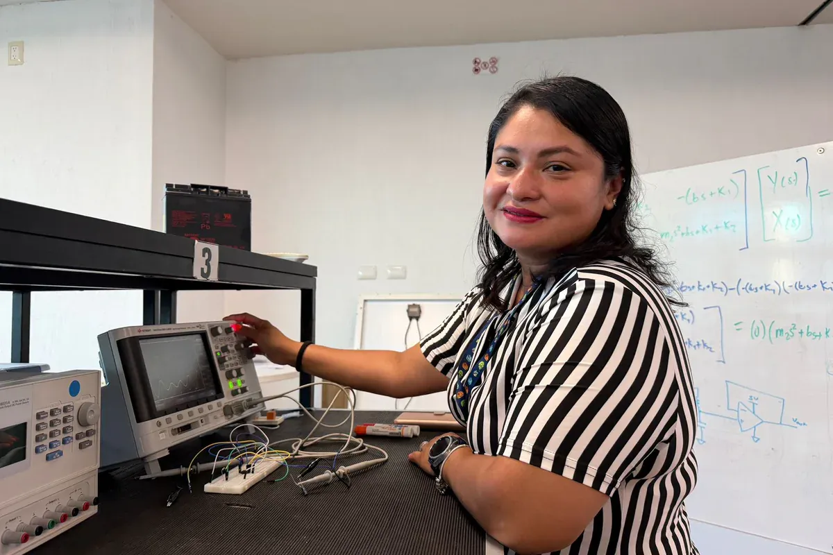 Engineer using laboratory instruments to validate an electronics circuit