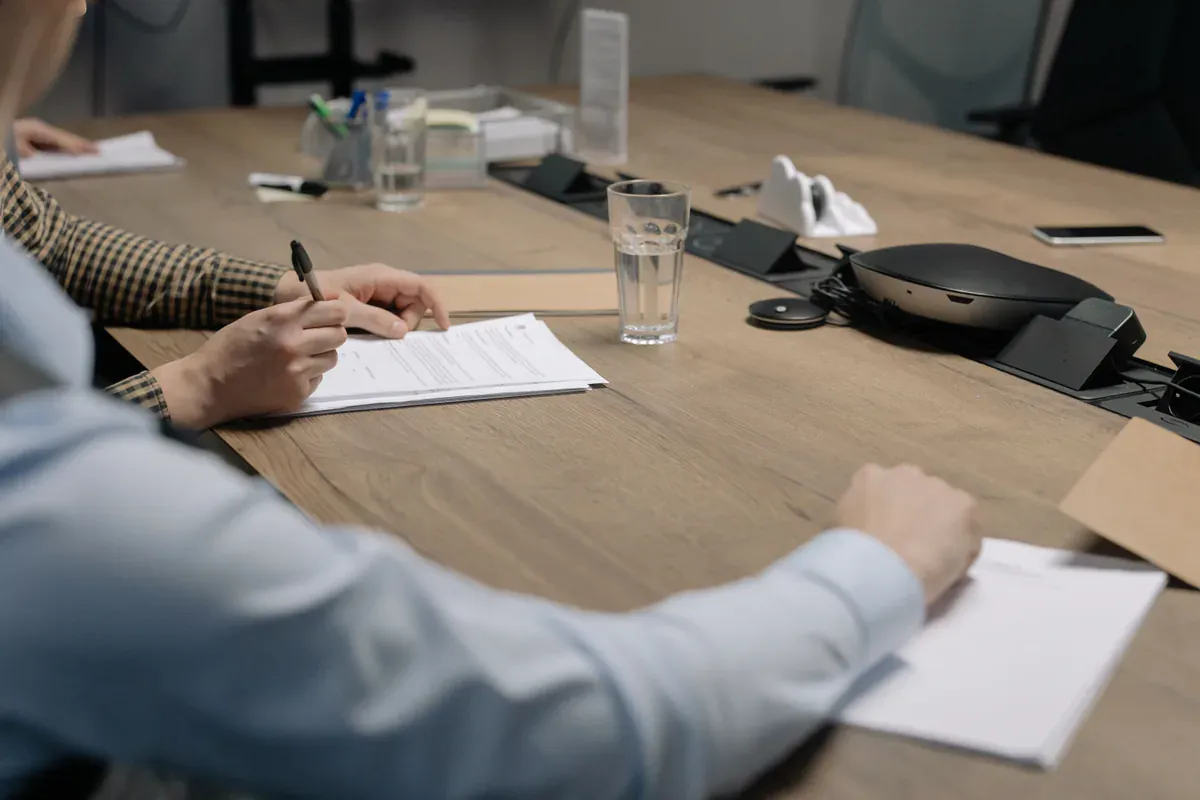Several supplier quotations being compared on a procurement desk