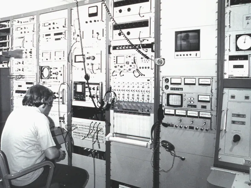 Engineer checking electronics used for signal reception and processing