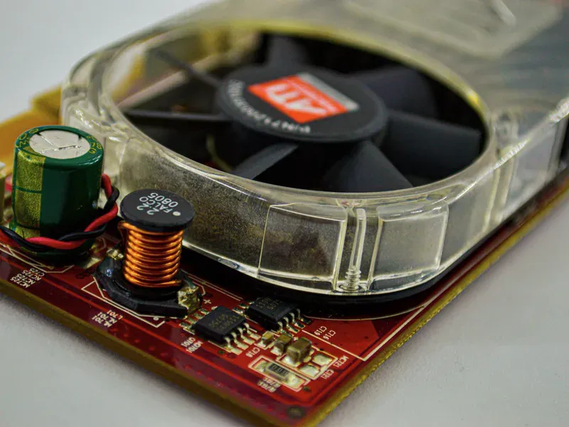 Cooling fan and capacitor mounted on a computer circuit board
