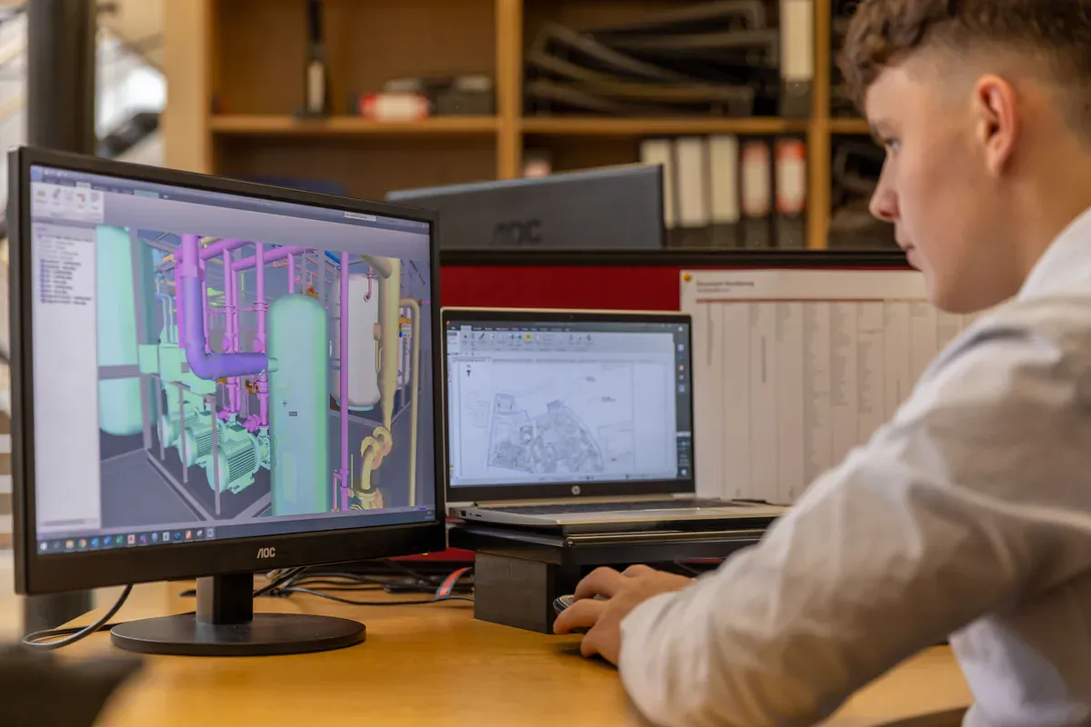 Procurement engineer reviewing a bill of materials and component quotations