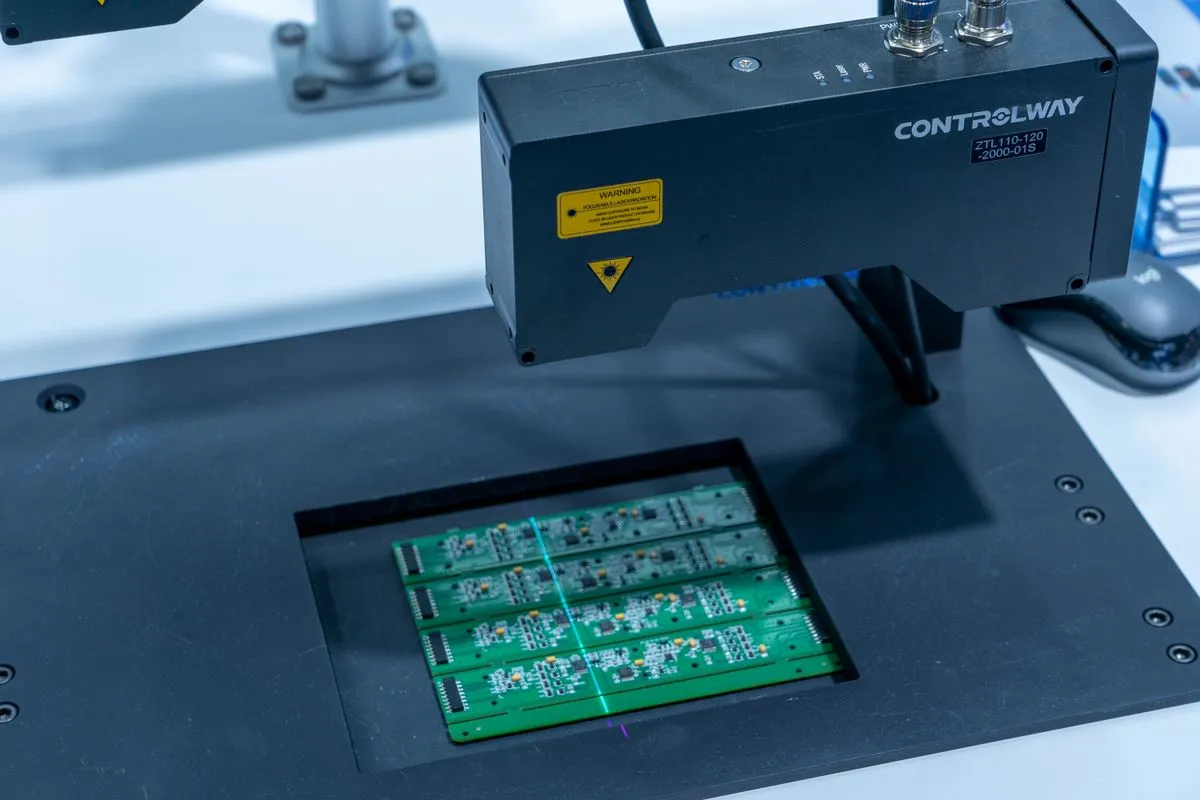 Automated optical inspection equipment scanning populated circuit boards