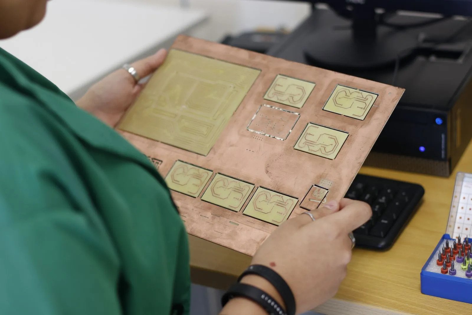 Engineer examining a circuit-board layout before assembly