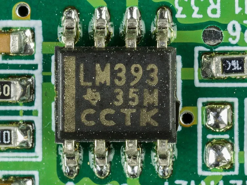 LM393 comparator mounted among components on a circuit board