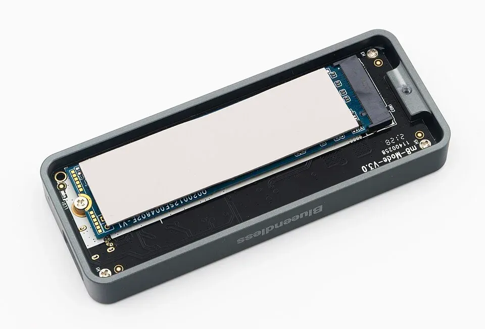 Thermal pad covering an SSD inside an aluminum enclosure
