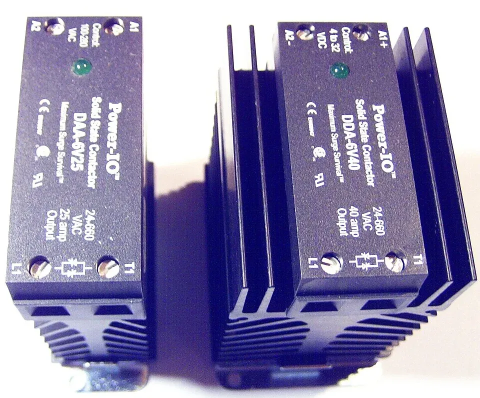 Solid state relay modules mounted on finned heatsinks