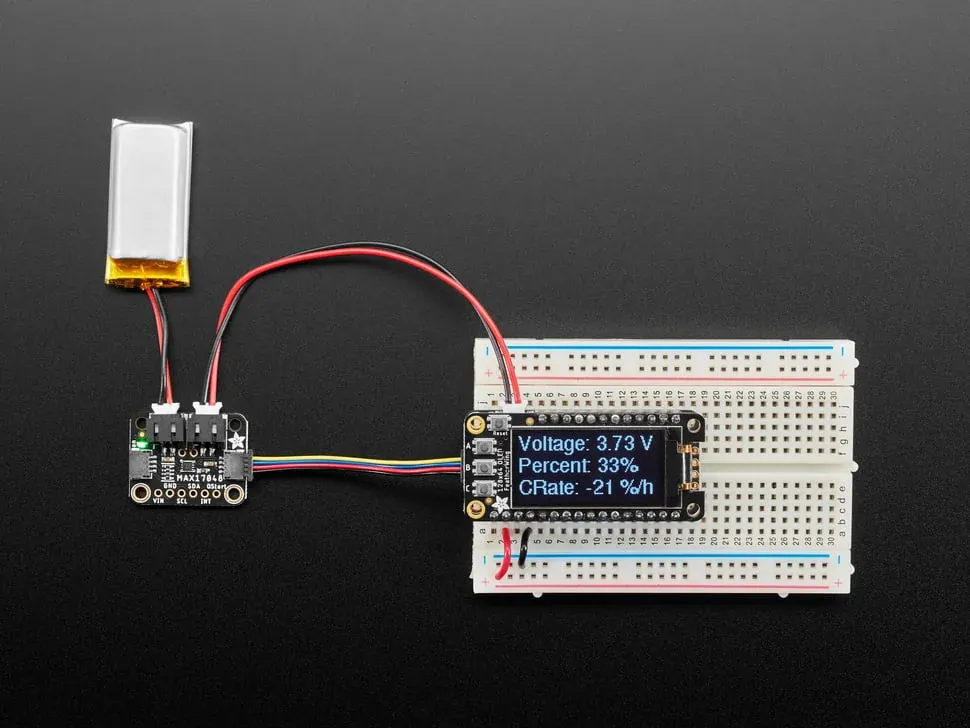 MAX17048 breakout connected to a pouch cell and an OLED battery readout