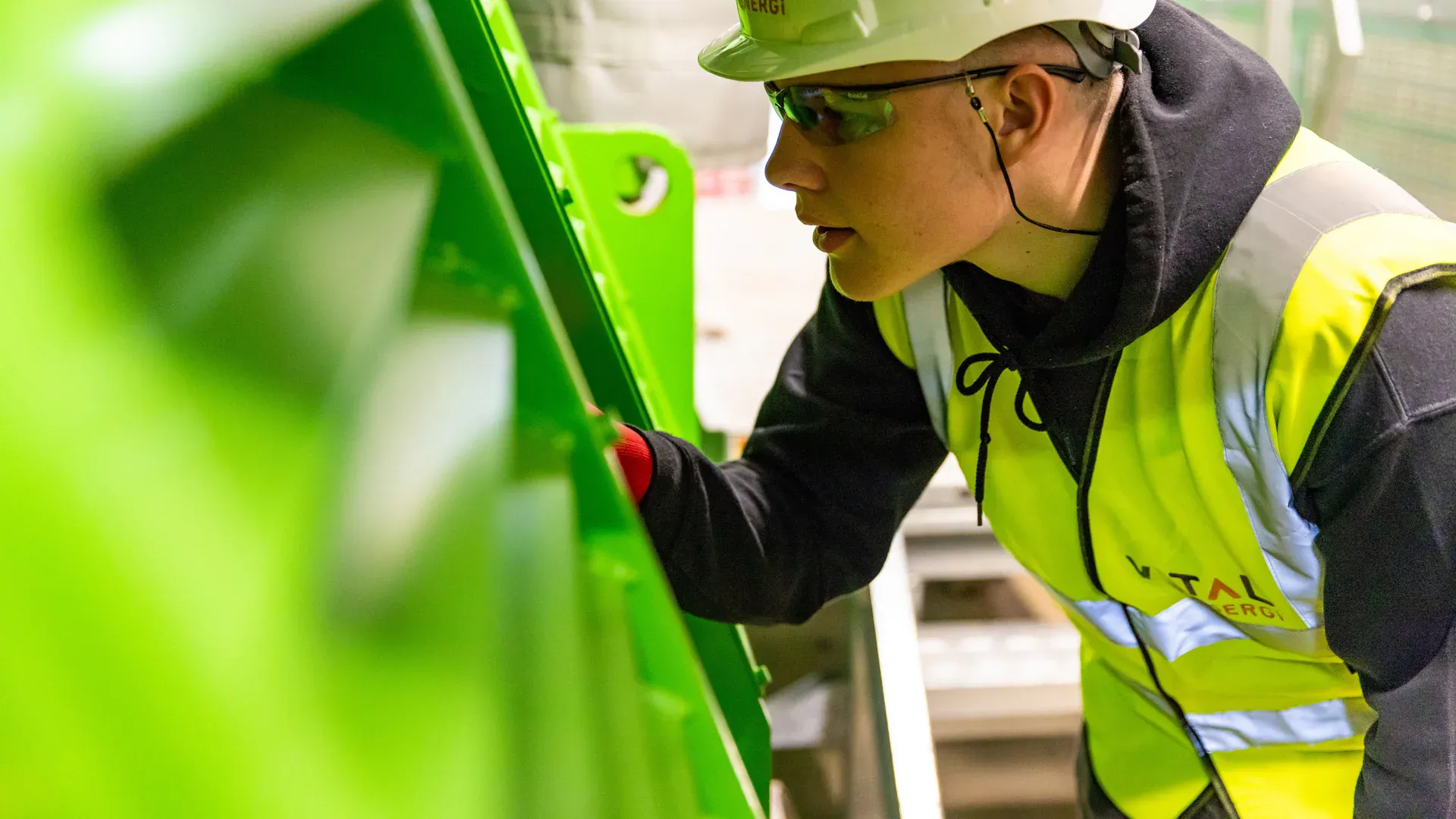 Maintenance engineer inspecting industrial factory equipment